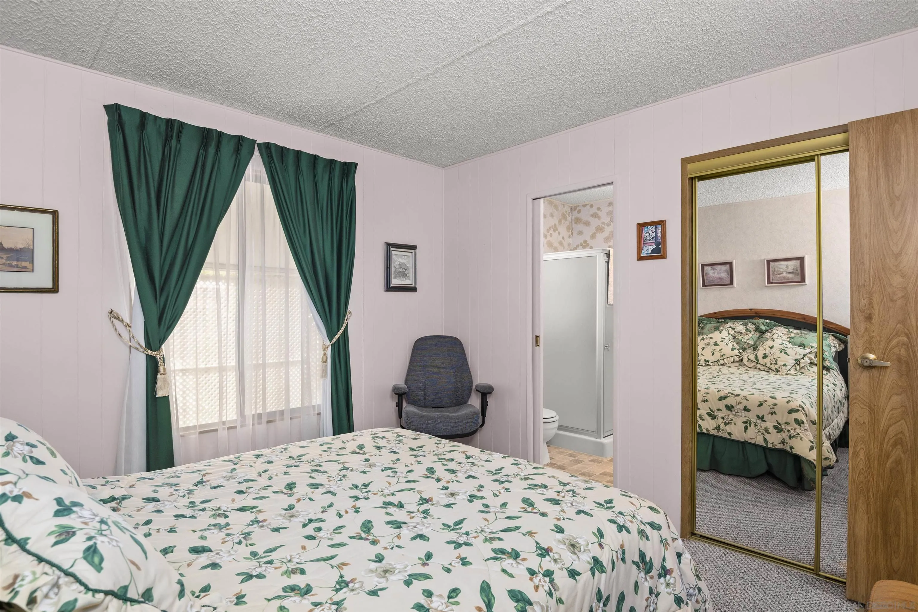 4747 Oak Crest Road, Unit 19 Fallbrook, CA 92028 - Photo 23 of 53 a bedroom with a bed and a window