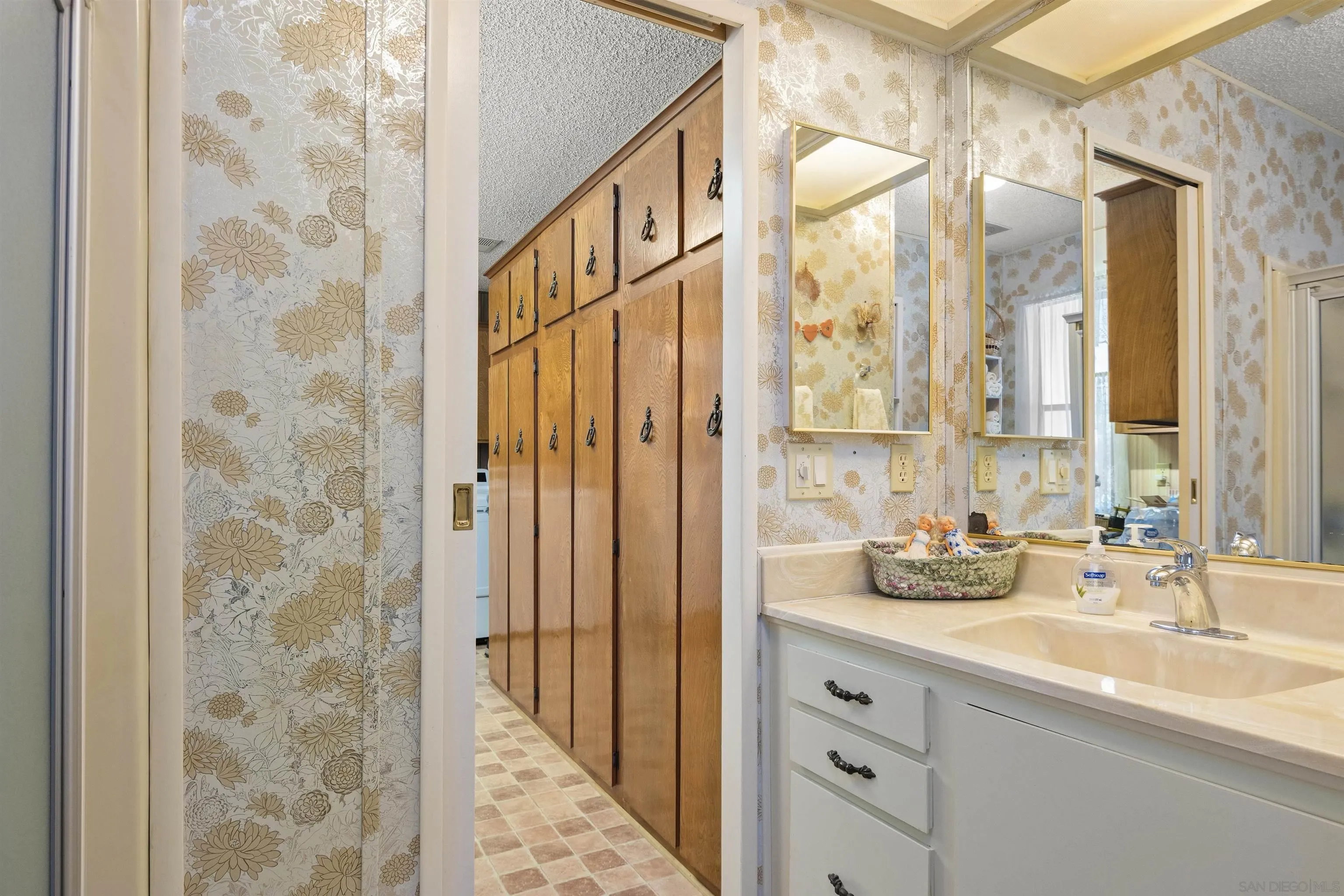 4747 Oak Crest Road, Unit 19 Fallbrook, CA 92028 - Photo 25 of 53 a bathroom with a double vanity sink mirror and shower