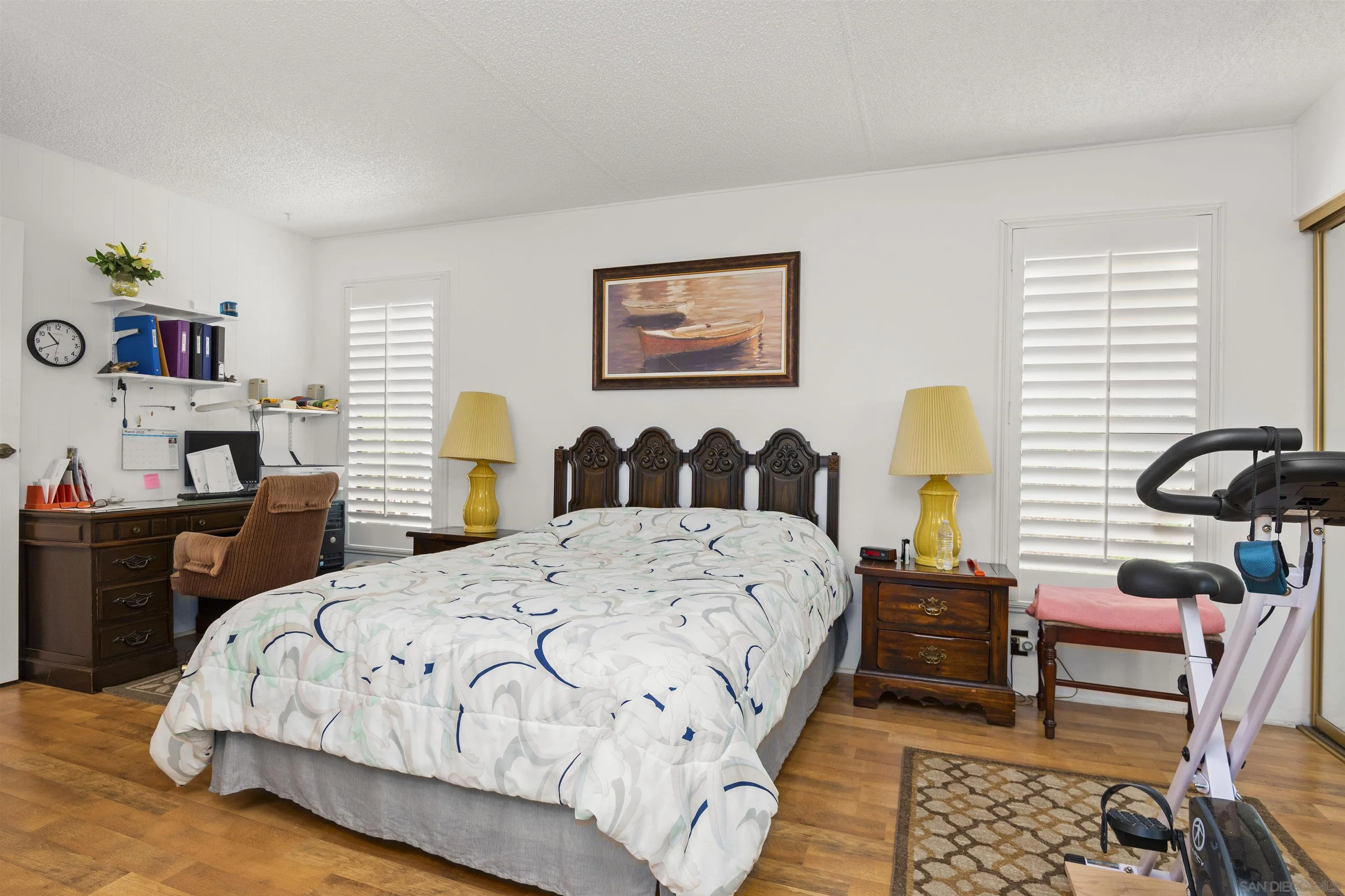 4747 Oak Crest Road, Unit 19 Fallbrook, CA 92028 - Photo 26 of 53 a bedroom with a bed and a table in it