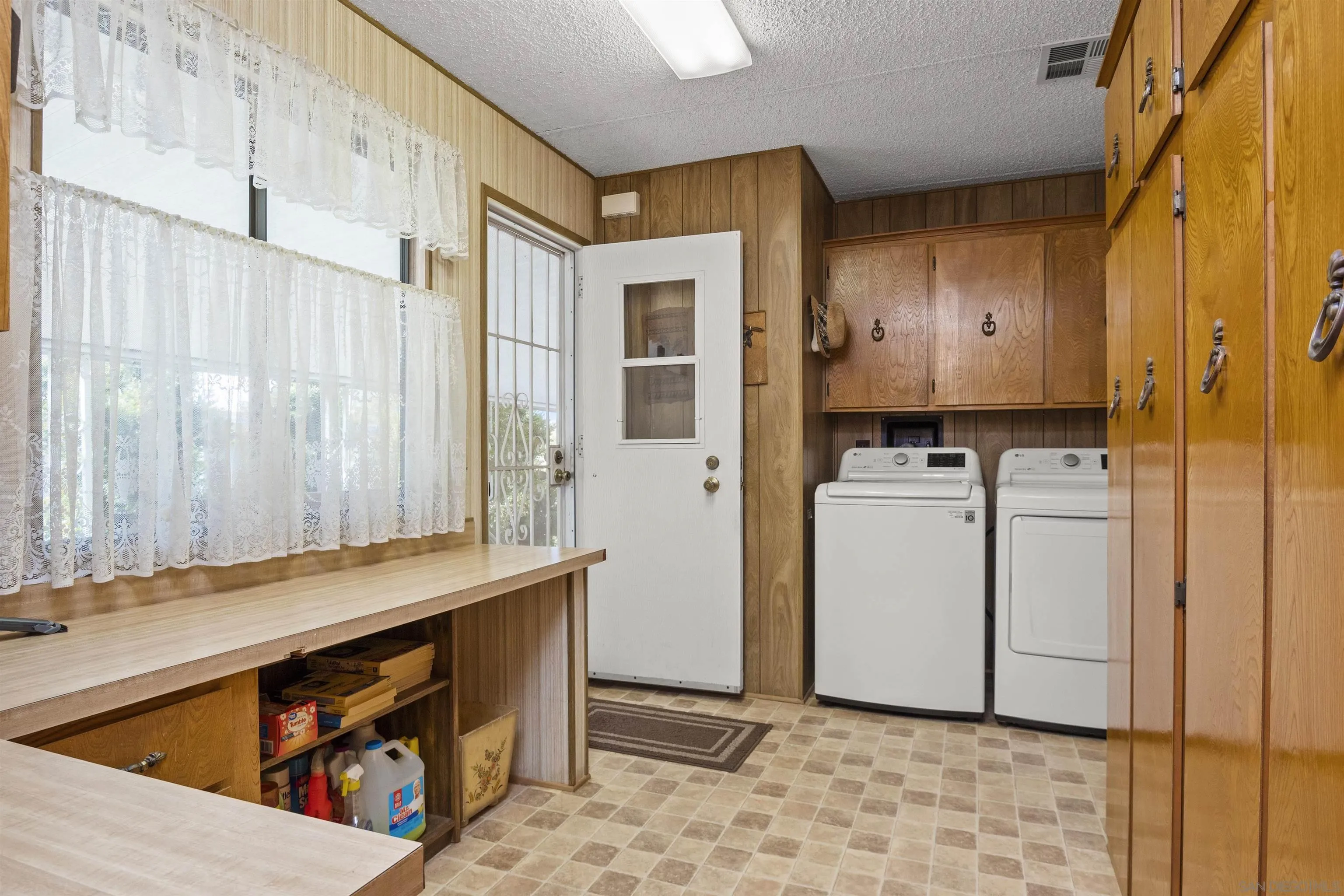 4747 Oak Crest Road, Unit 19 Fallbrook, CA 92028 - Photo 31 of 53 a utility room with cabinets