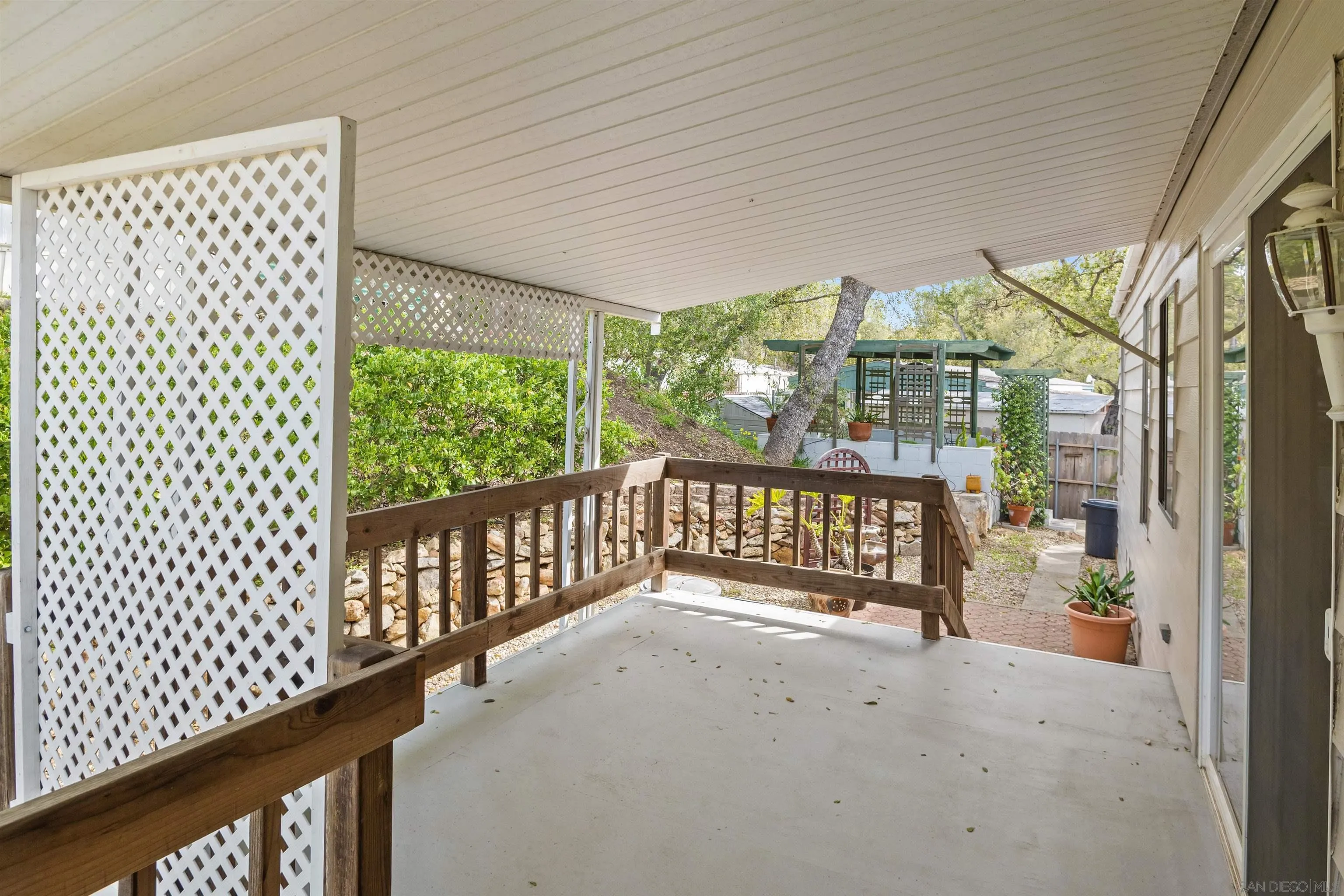 4747 Oak Crest Road, Unit 19 Fallbrook, CA 92028 - Photo 33 of 53 a view of porch with a bench