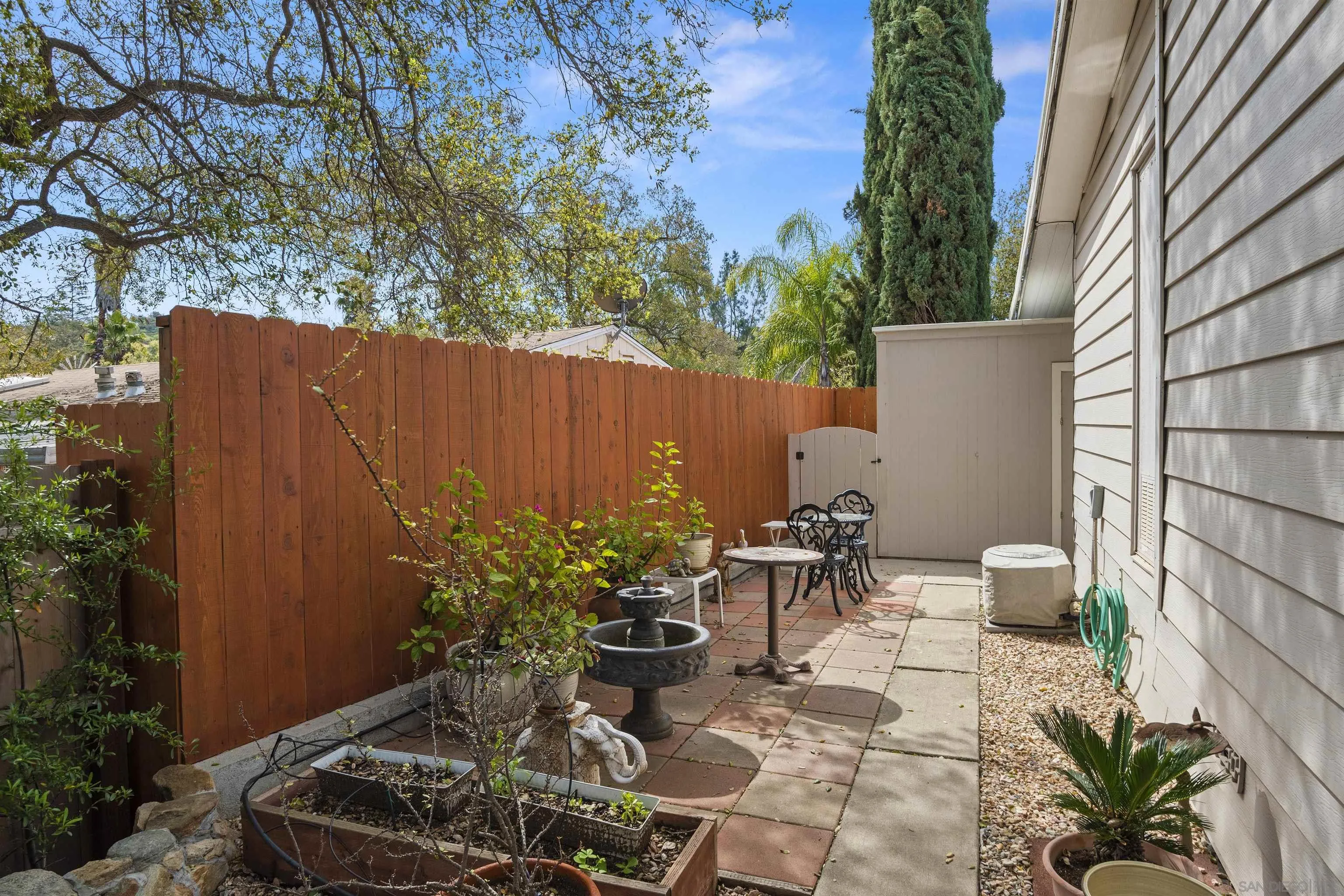 4747 Oak Crest Road, Unit 19 Fallbrook, CA 92028 - Photo 39 of 53 a view of a backyard with chair and potted plants