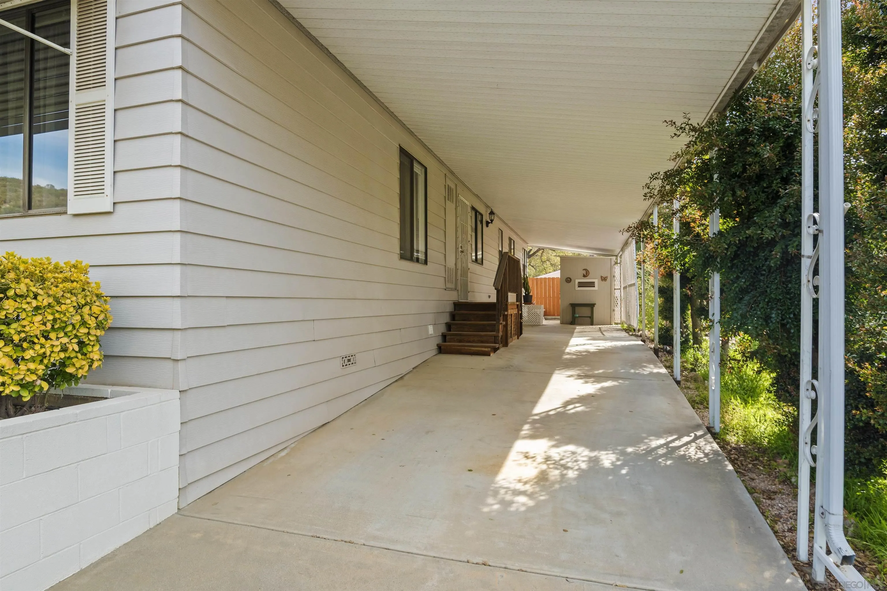 4747 Oak Crest Road, Unit 19 Fallbrook, CA 92028 - Photo 42 of 53 a view of a pathway of a house with a yard