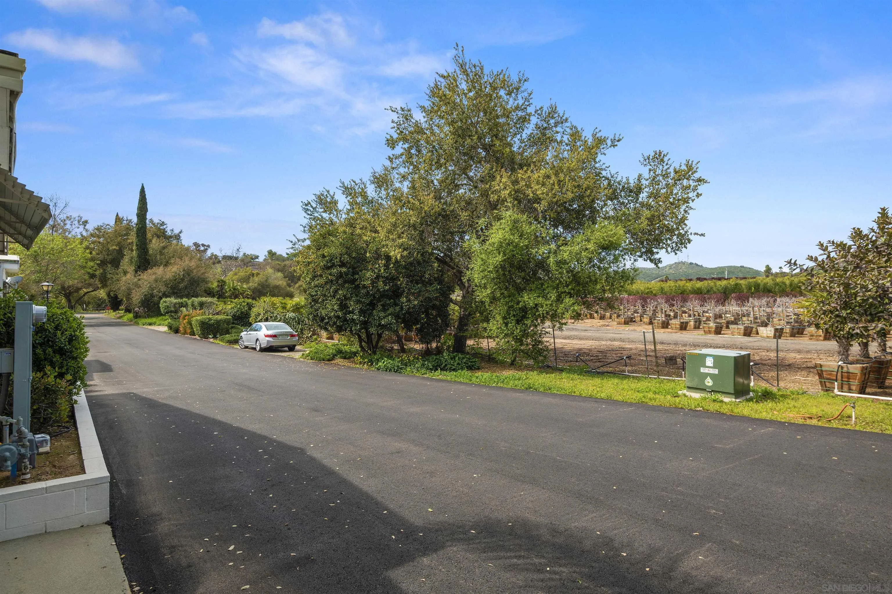 4747 Oak Crest Road, Unit 19 Fallbrook, CA 92028 - Photo 44 of 53 a view of a road with a yard