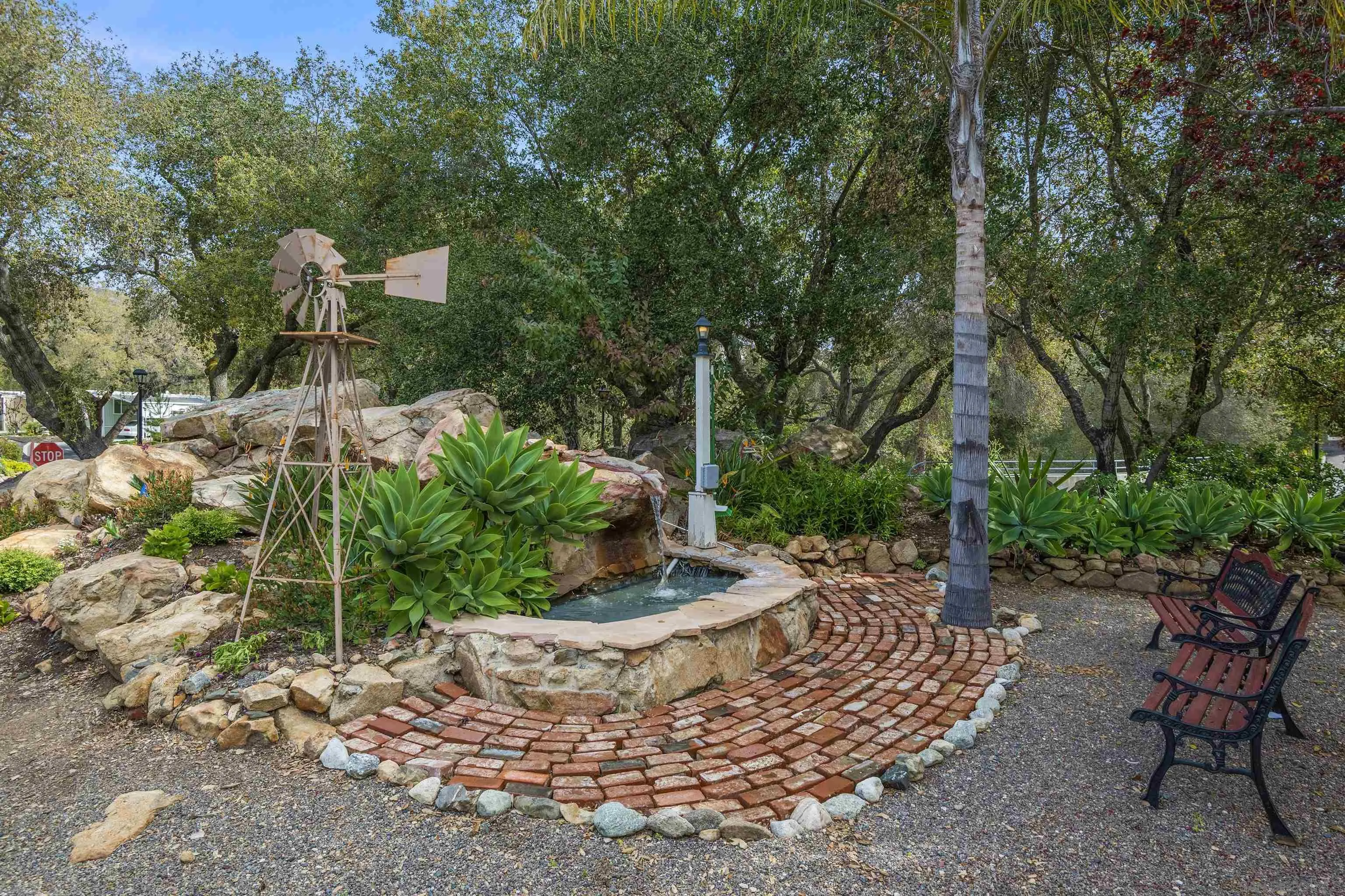 4747 Oak Crest Road, Unit 19 Fallbrook, CA 92028 - Photo 46 of 53 a view of a backyard with plants and a patio
