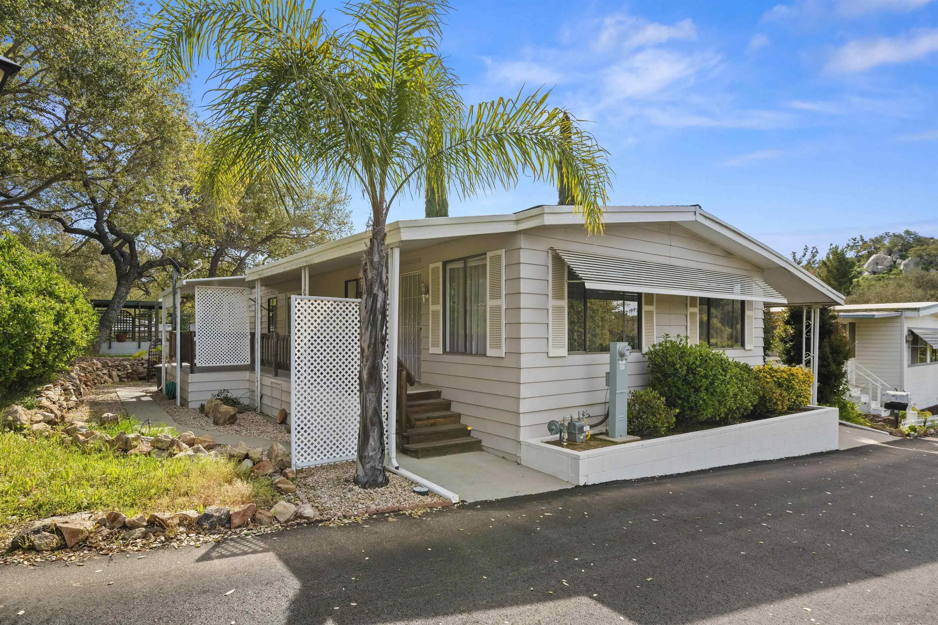 4747 Oak Crest Road, Unit 19 Fallbrook, CA 92028 - Photo 9 of 53 front view of a house with a yard