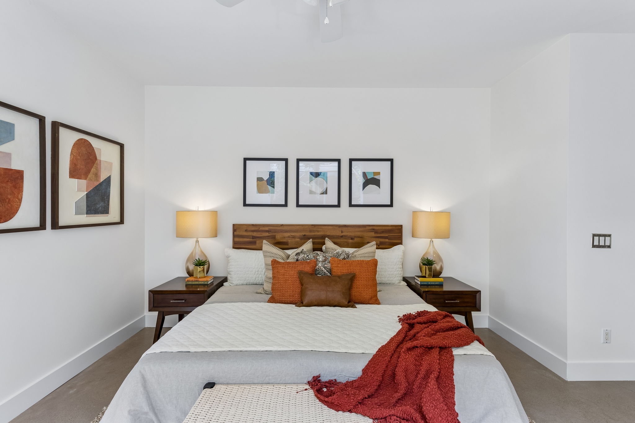 5305 Guadalupe Street, Unit A Austin, TX 78751 - Photo 12 of 31 King Sized Bedroom with a ceiling fan and finished concrete flooring