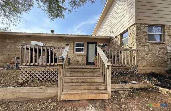 a front view of a house with stairs