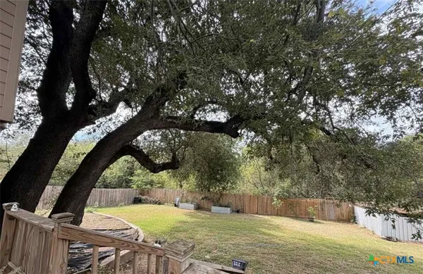 a view of a pool with a yard