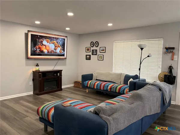 a bedroom with bed and a couch