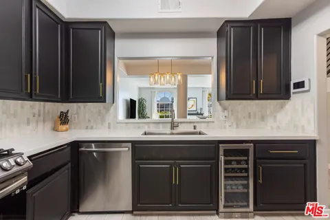 a kitchen with a sink and a stove