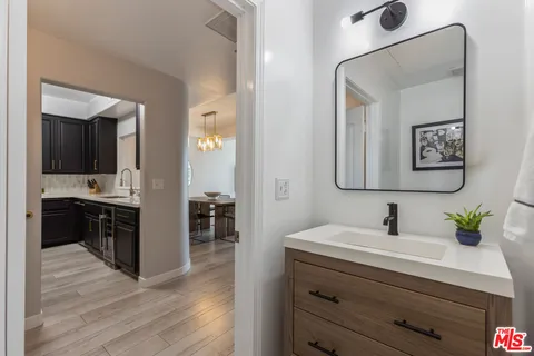 a spacious bathroom with a sink double vanity and a mirror