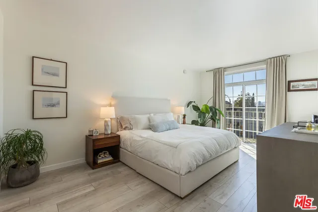 a bedroom with a bed and a table