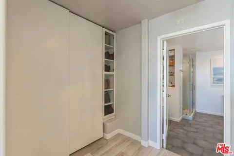 a view of a hallway and dining room