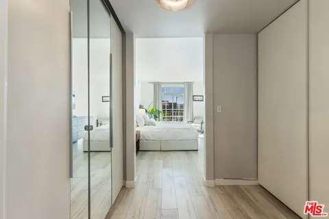 a spacious bathroom with a double vanity sink a mirror and a bathtub