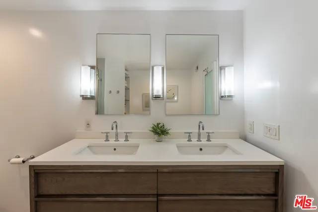 a bathroom with a shower and a mirror