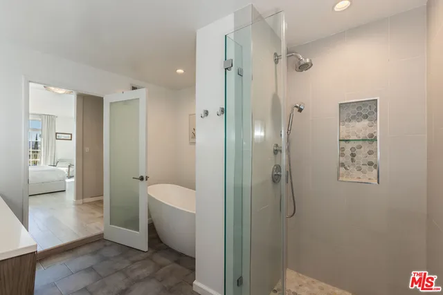 a white bath tub sitting in a bathroom