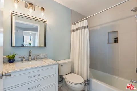 a view of hallway with wooden floor