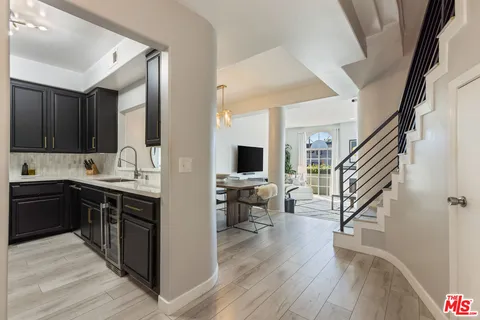 a view of kitchen with sink microwave and stove