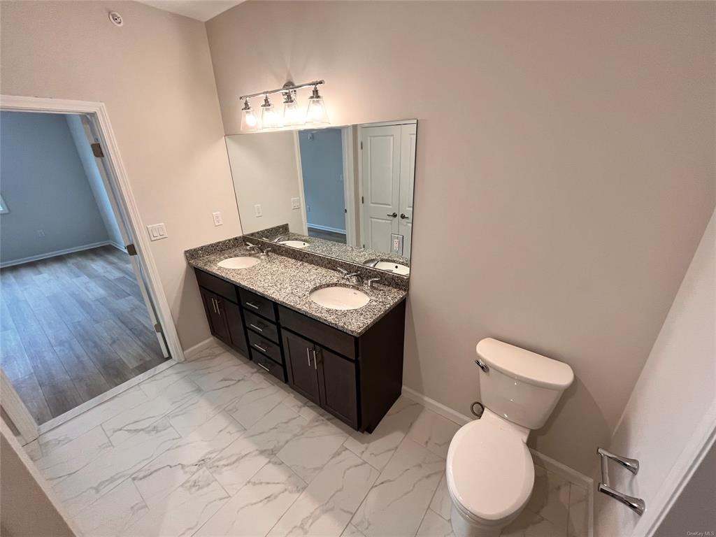 227 Tower Ridge Circle, Unit 227 Middletown, NY 10941 - Photo 6 of 16 Bathroom featuring twin vanity sink granite top