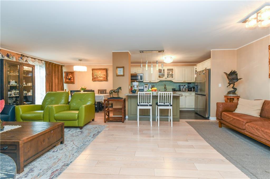 601 Surf Avenue, Unit 20J Brooklyn, NY 11224 - Photo 13 of 46 a living room with furniture and a view of kitchen