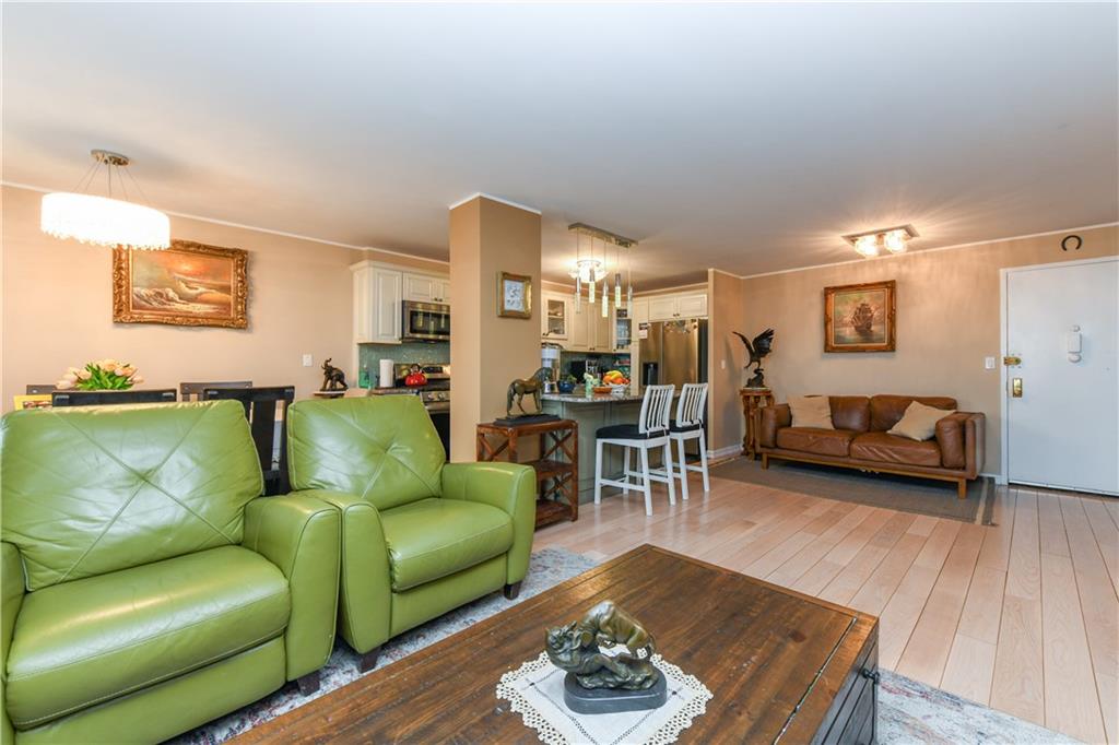 601 Surf Avenue, Unit 20J Brooklyn, NY 11224 - Photo 14 of 46 a living room with furniture and a wooden floor