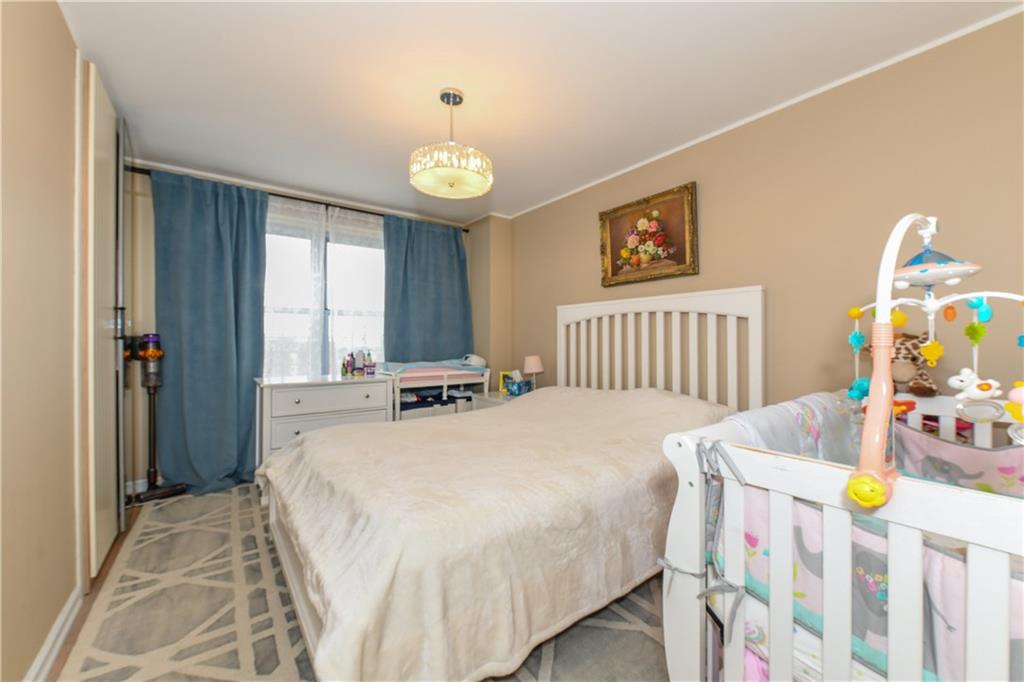 601 Surf Avenue, Unit 20J Brooklyn, NY 11224 - Photo 16 of 46 a bedroom with bed and a window