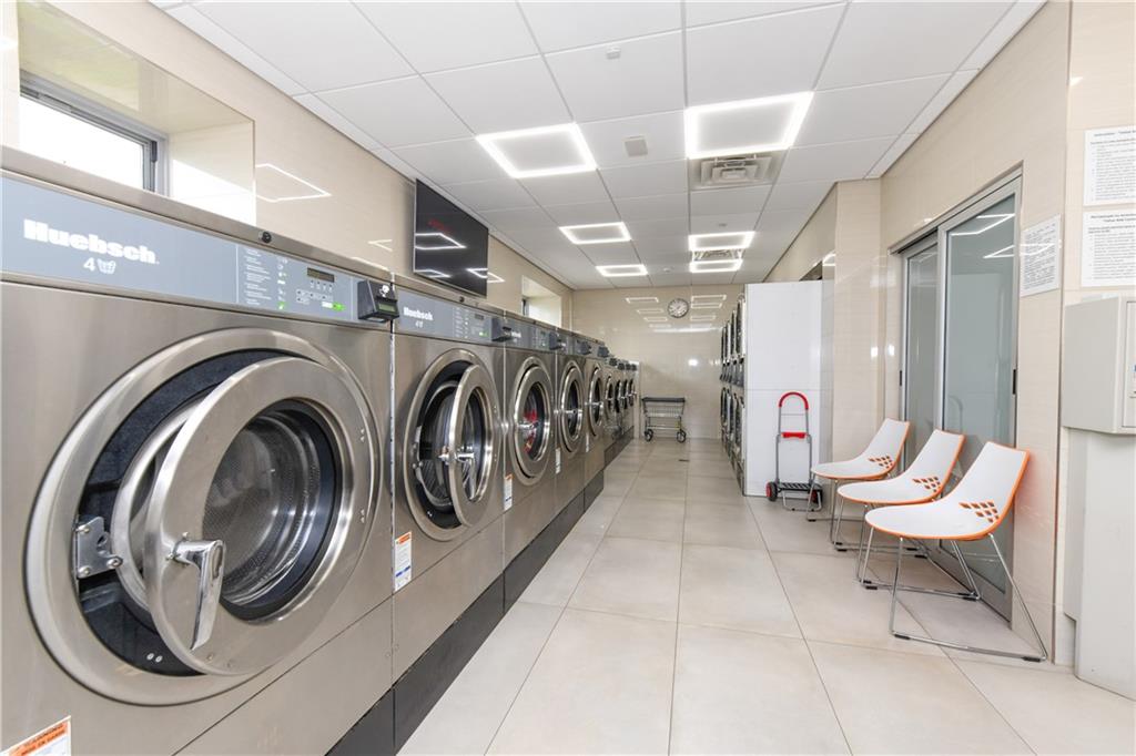601 Surf Avenue, Unit 20J Brooklyn, NY 11224 - Photo 19 of 46 a view of a hallway with washer and dryer