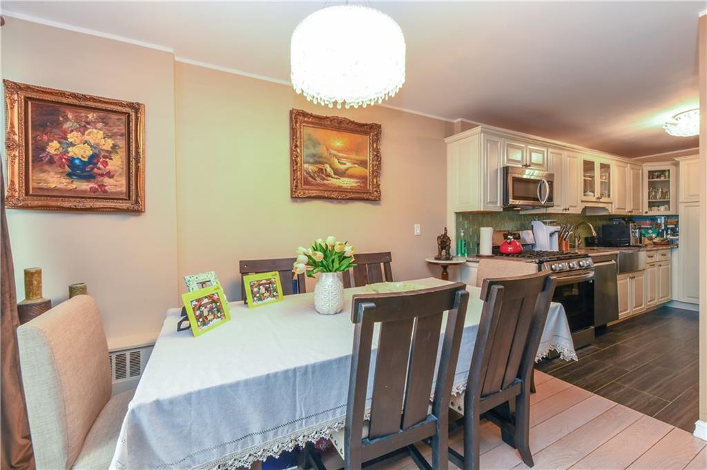 601 Surf Avenue, Unit 20J Brooklyn, NY 11224 - Photo 10 of 46 a living room with furniture a flat screen tv and kitchen view