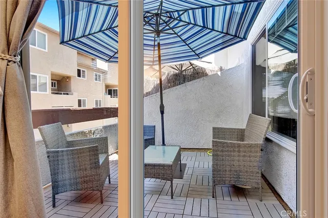 a view of a balcony with furniture