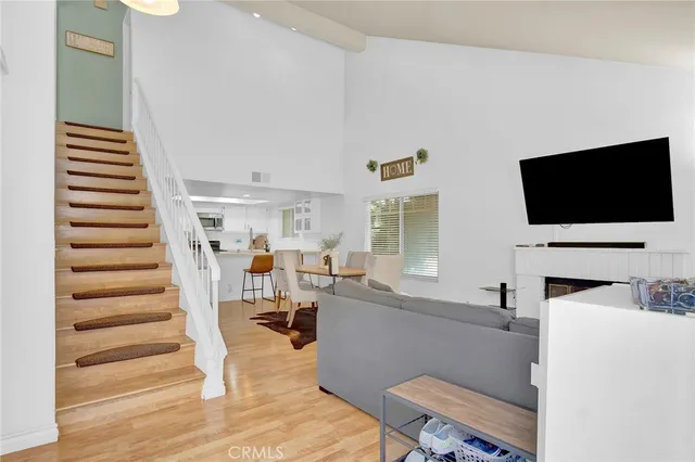 a view of a livingroom with furniture and a flat screen tv