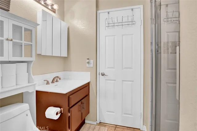 a utility room with cabinets washer and dryer