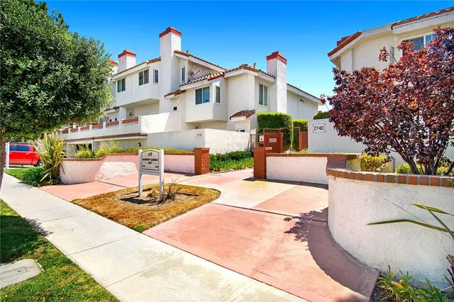 a front view of a house with sitting area