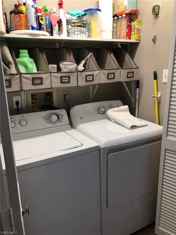 252 Pebble Beach Circle, Unit C103 Naples, FL 34113 - Photo 20 of 21 a utility room with dryer and washer