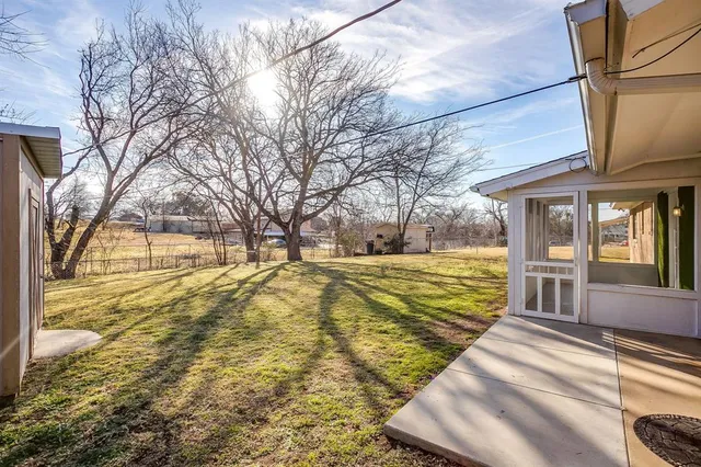 a view of yard covered with snow in the front