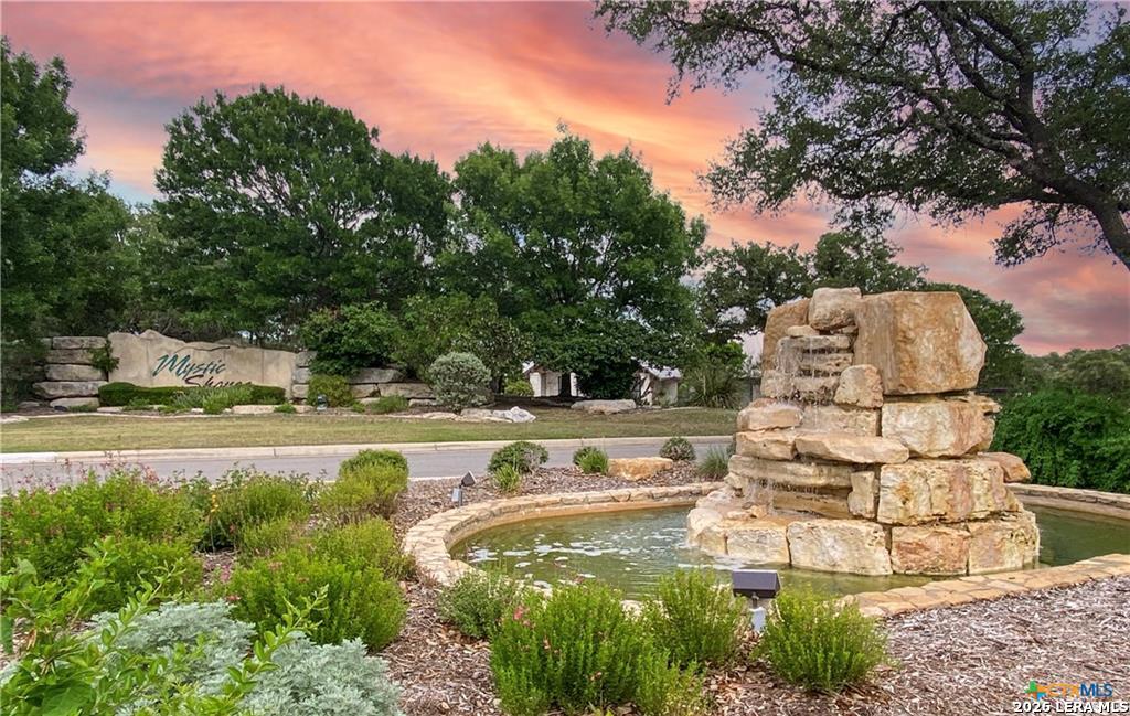 a view of a water fountain in front of the house