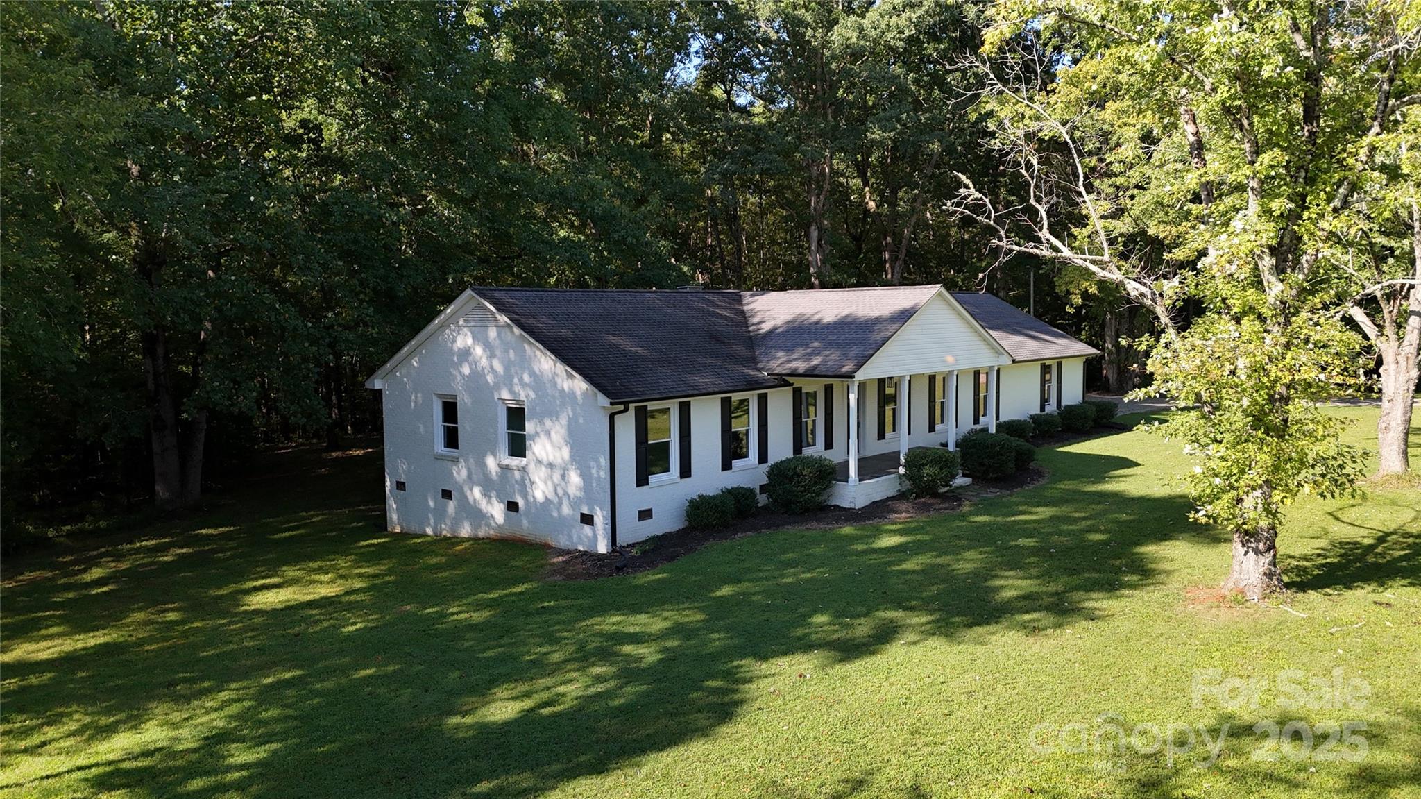 5406 Christopher Road Iron Station, NC 28080 - Photo 21 of 23 a view of a house with a big yard plants and large trees