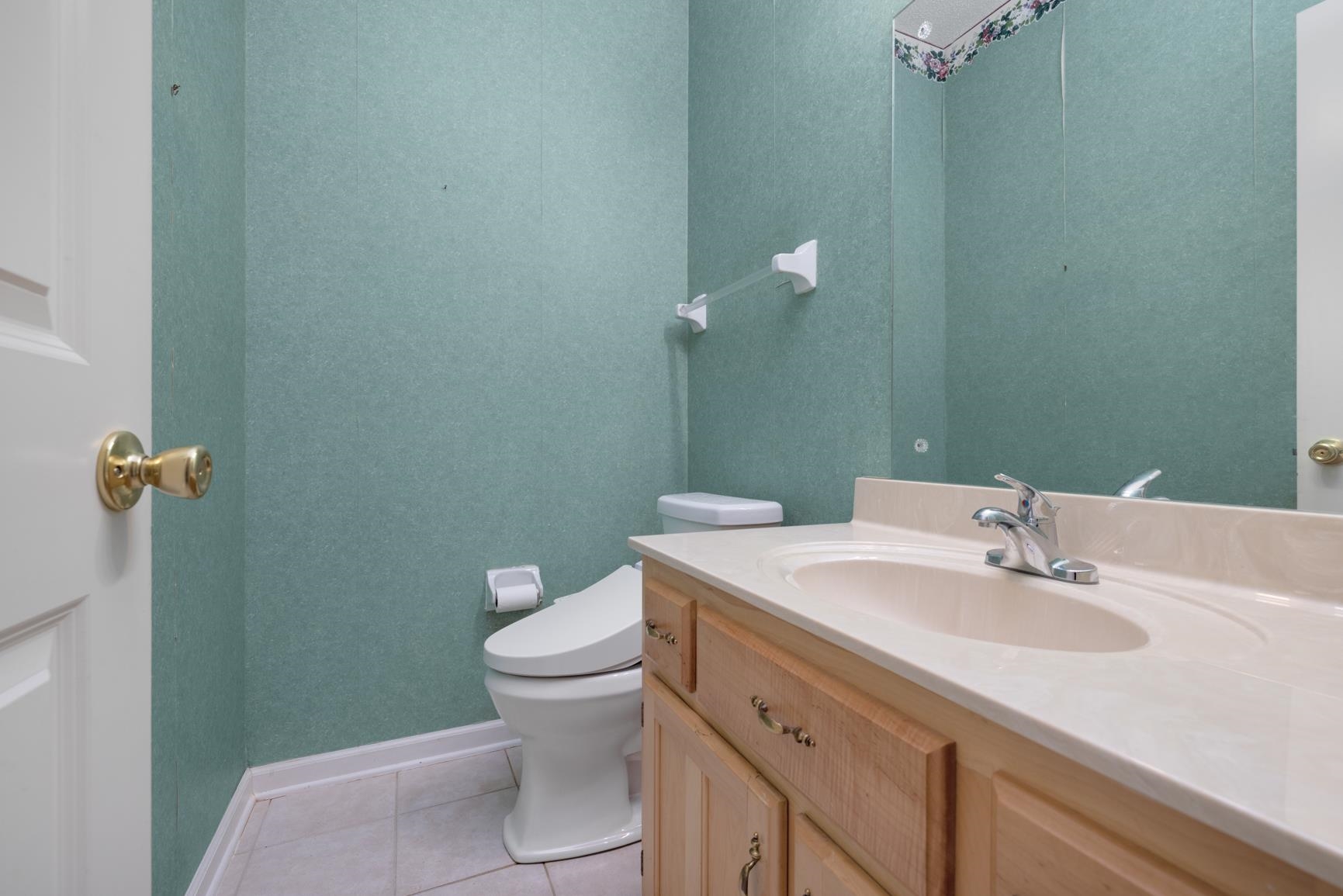 9015 Raspberry Lane Cordova, TN 38016 - Photo 21 of 40 Bathroom with tile patterned floors, vanity, and toilet