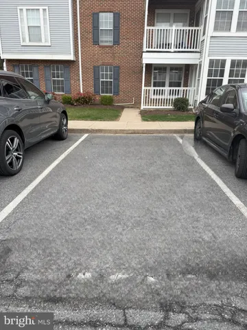 a view of a car parked in front of a house