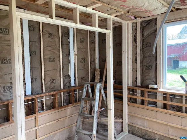 a view of house with backyard and garden