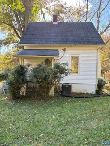 a view of a room with wooden floor and windows