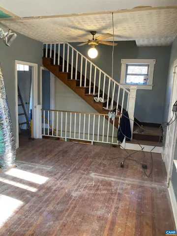 a view of entryway with wooden floor and door