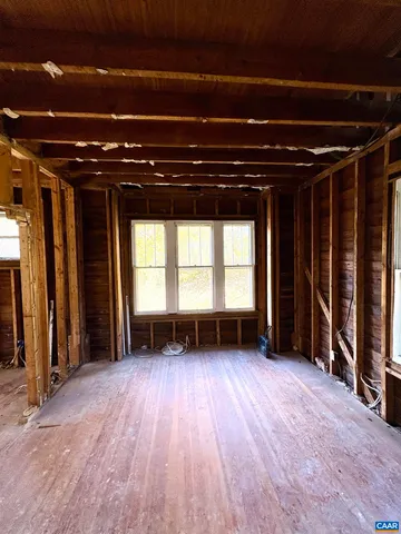 a view of an empty room with windows