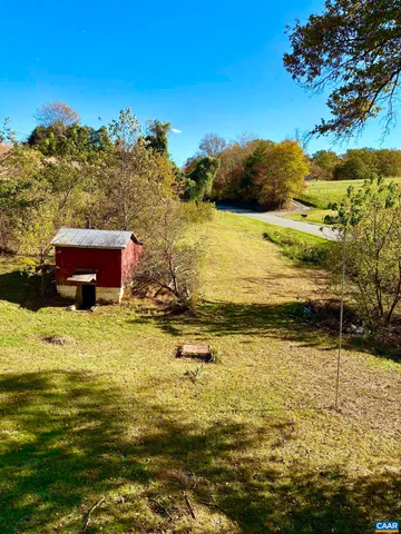 a living room with patio furniture and a window