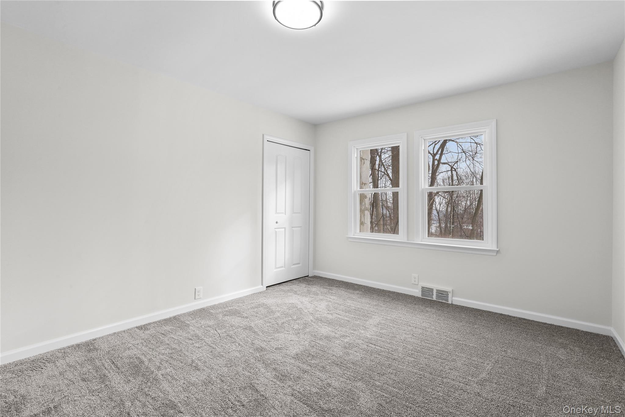 28 Quaker Road Carmel, NY 10512 - Photo 11 of 16 an empty room with windows