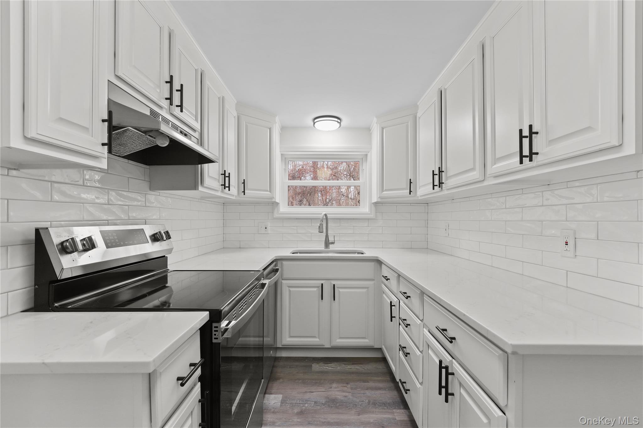 28 Quaker Road Carmel, NY 10512 - Photo 3 of 16 a kitchen with a sink appliances and cabinets