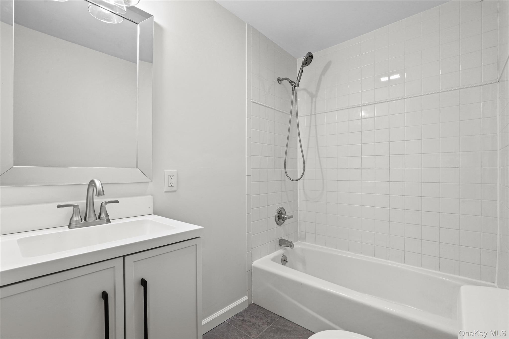 28 Quaker Road Carmel, NY 10512 - Photo 9 of 16 a bathroom with a sink a toilet and shower