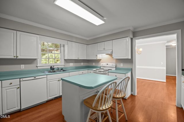 a view of a balcony with wooden floor and fence