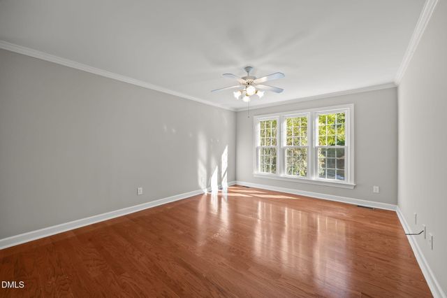a white bath tub sitting next to a toilet