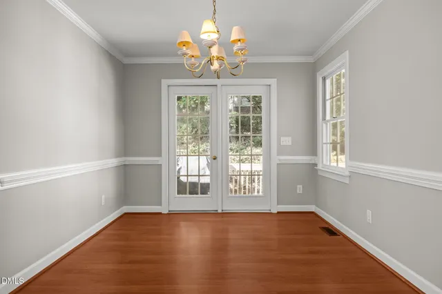 a kitchen with stainless steel appliances granite countertop a stove a sink dishwasher and a refrigerator